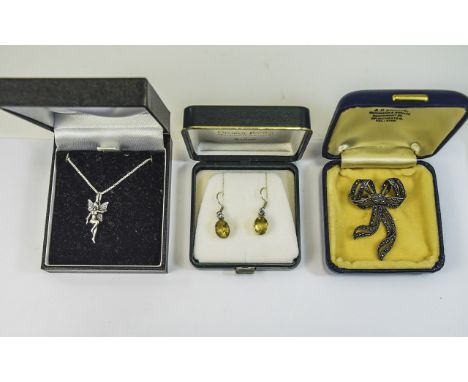 Three Pieces of Jewellery comprising marcasite bow brooch, silver drop earrings and a silver pixie pendant and chain.