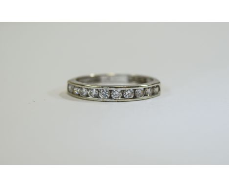 18ct Ladies Channel Set Diamond Ring Set with eleven bright diamonds, fully hallmarked, nice condition