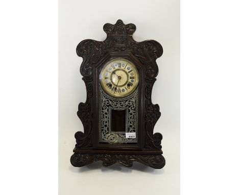 Early 20thC Oak Cased 8 day Movement Hanging/Mantle Clock from the Ansonia Clock Company. Enamel dial with Roman Numerals. 22