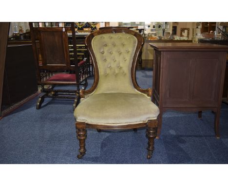 Victorian Spoon Backed Armchair with Mahogany frame and padded seat and button back