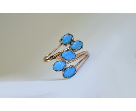 Kingman Turquoise Crossover Ring, mined in Arizona and similar to Sleeping Beauty turquoise, the five oval cut cabochons tota