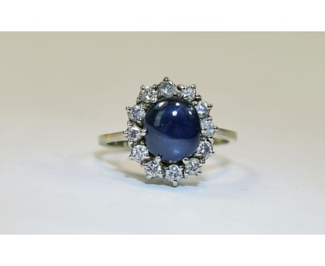 18ct Gold Diamond And Sapphire Cluster Ring Central Cabochon Cut Sapphire Surrounded By 12 Round Brilliant Cut Diamonds, Stam