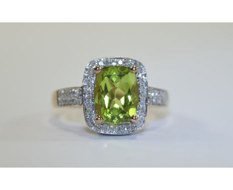 14ct Gold Set Peridot and Diamond Cluster Ring. The Central Peridot Surrounded by Small Diamonds Which Extend to Shoulders. M