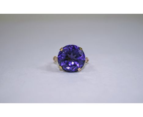 Ladies 9ct Gold Set Single Stone Amethyst Dress Ring. The Large Faceted Amethyst of Excellent Colour, Est Weight 10 cts. Gold