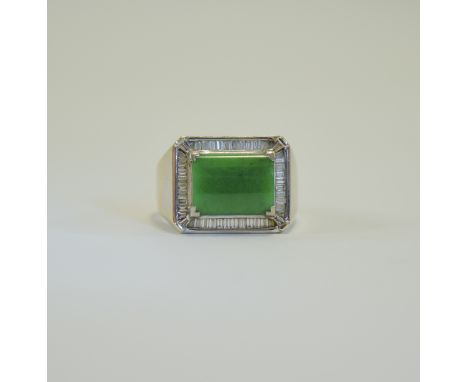 18ct White Gold Jade and Baguette Cut Diamond Ring. Marked 750, The Central Convex Jade (11.9x8.9mm) Surrounded by Baguette C