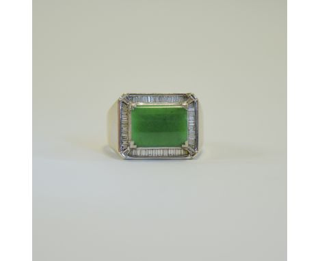 18ct White Gold Jade and Baguette Cut Diamond Ring. Marked 750, The Central Convex Jade (11.9x8.9mm) Surrounded by Baguette C