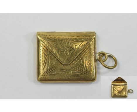 Stamp box Small Gold tone stamp box in envelope shape with hinged closure, engraved filigree design throughout