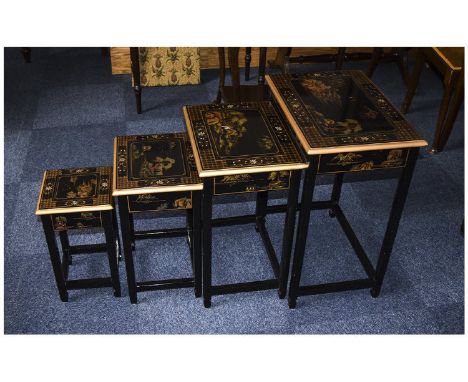 A Matching Set of 4 Graduated Side Tables, Decorated with Japanese Scenes on a Black Polished Lacquered Back Ground with Gold