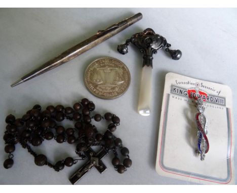 A mid-20th century silver and mother of pearl handled baby's rattle, together with an American Pacific Mint 1982 one troy oun