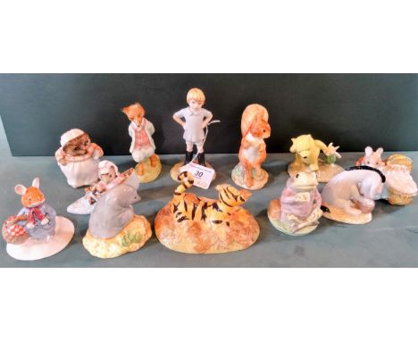 A collection of ornamental ceramic figurines, to include: Royal Doulton Winnie the Pooh Collection figures, Royal Albert Beat