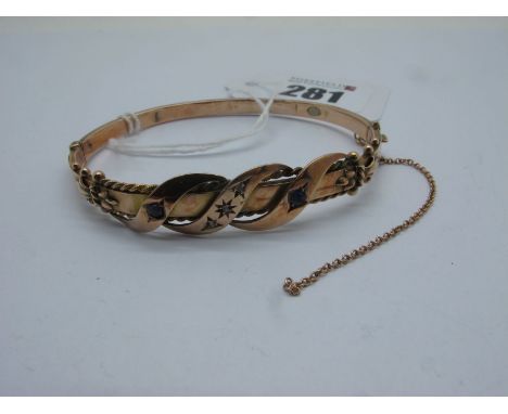 An Edwardian Hinged Bangle, of shaped design, with inset highlights, hinged to snap clasp (safety chain broken), Birmingham 1