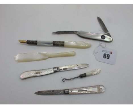 Hallmarked Silver and Mother of Pearl Folding Fruit Knives, a mother of pearl handled button hook, a mother of pearl handled 