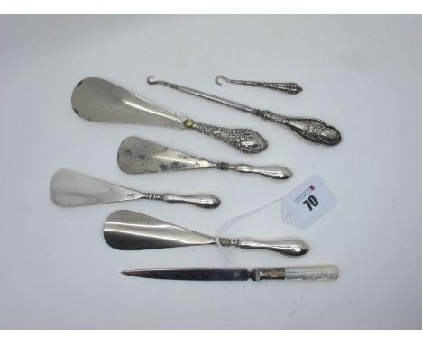 Hallmarked Silver Handled and Other Shoe Horns, a mother of pearl handled letter opener, two button hooks. 