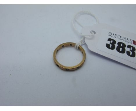 An Eternity Band, with inset highlights (losses), stamped "9ct" (finger size K) (1.6grams). 