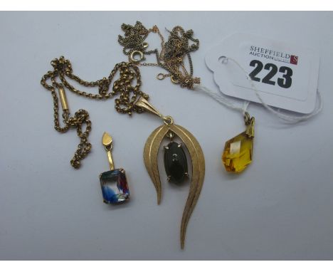 A Single Stone Pendant, of abstract design, oval claw set to the centre, on a chain; together with two further pendants. 