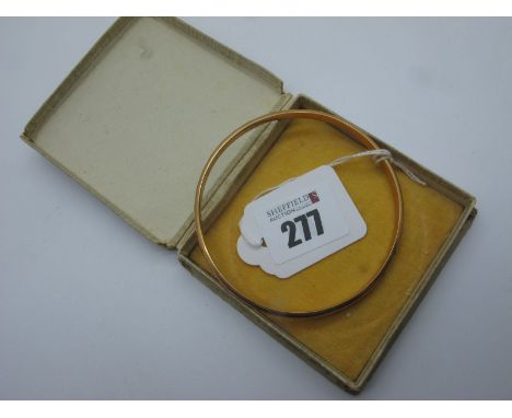 A 9ct Gold Bangle, (dents). (6.5 grams)