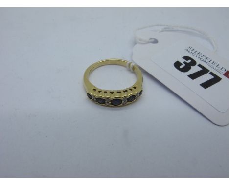 A Modern Sapphire and Diamond Set Ring, alternately set, stamped "750 DIA" (finger size K) (3.2grams).