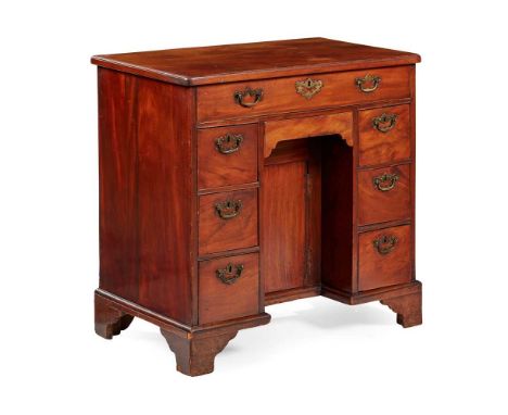 with an arrangement of eight drawers enclosing a kneehole recess and cupboard, on bracket feet80cm wide, 79cm high, 48.5cm de