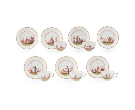 painted with Chinoiserie scenes depicting figures engaged in various pursuits, within concentric iron-red circles, with gilt 