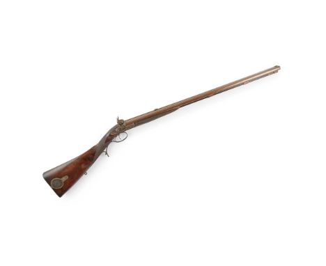 with re-browned Damascus barrels, central raised rib and folding leaf sights, with cross-over stock, engraved patch box and o