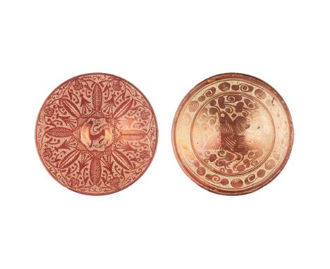 the first depicting a bird amongst foliage, late 17th/ early 18th century, 33.5cm diameter; the second a charger, centred by 