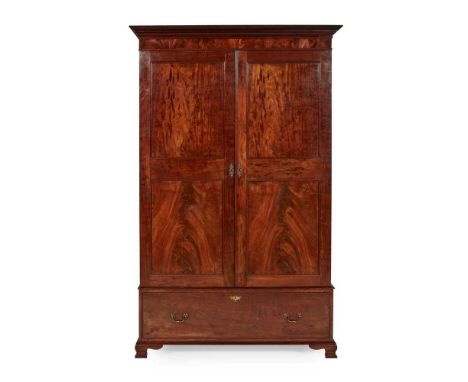 in the Georgian style, the moulded cornice above a pair of twin panel doors opening to hanging space, over a deep base drawer