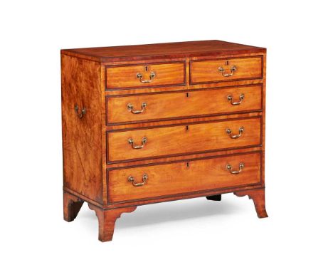 the crossbanded top over two short and three long drawers, with handles to the sides, raised on French bracket feet94cm wide,