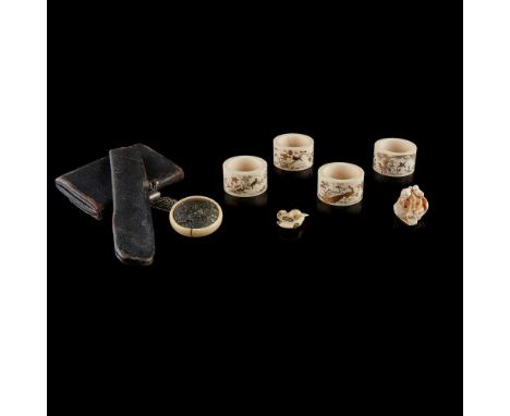 comprising four Shibayama napkin rings, depicting foliage, bamboo and birds, 5cm diam.; a netsuke of a Kinko riding a fish, s