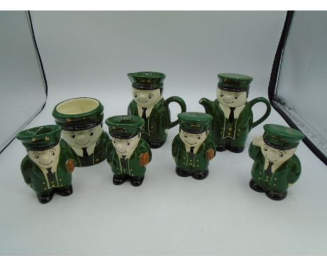 Harrods green suit man/bellboy china to incl teapot, milk jug, mug, 2x egg cups and salt and pepper set (7 items)