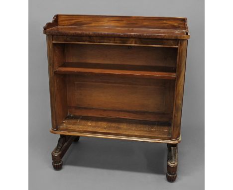 A WILLIAM IV MAHOGANY DOUBLE-SIDED OPEN BOOKCASE, in the manner of Gillows, the shelved top with wavy ends above panelled sid