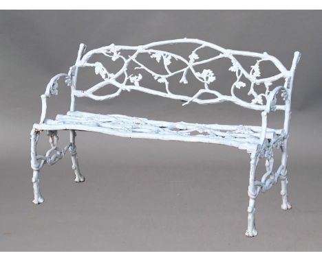 A COALBROOKDALE STYLE CAST IRON GARDEN BENCH, in an oak leaf and acorn design in the manner of J. Hayward of Derby, height 80