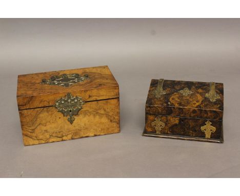 A 19TH CENTURY WALNUT TEA CADDY, of rectangular form with brass handle and mounts, the interior with twin lidded canisters la