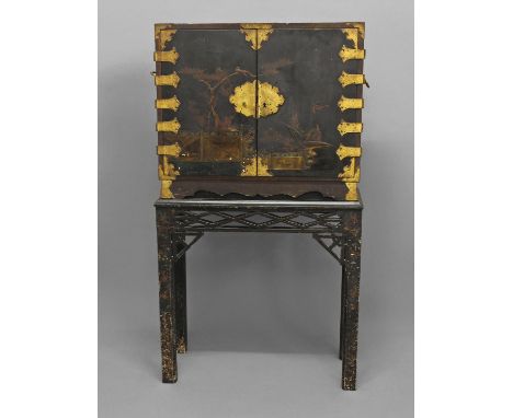 A CHINESE BLACK LACQUERED EXPORT CABINET, brass mounted with handles to each side, the lacquered doors depicting birds within