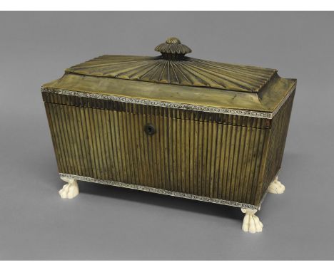 A GEORGE IV ANGLO-INDIAN HORN TEA CADDY, of sarcophagus form with flower finial, the hinged lid enclosing a fitted interior w