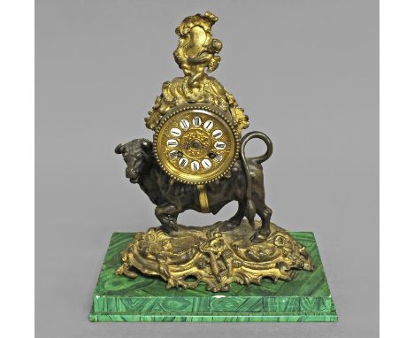 A FRENCH LOUIS XV STYLE MANTLE CLOCK, 19th century, the movement in a drum shaped case beneath a rococo cherub and resting on