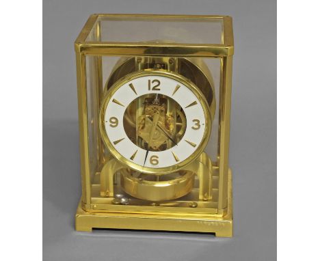 A JAEGER LECOULTRE ATMOS CLOCK, of traditional design, the 4 1/4" dial with skeletonised centre above a balance wheel and spi