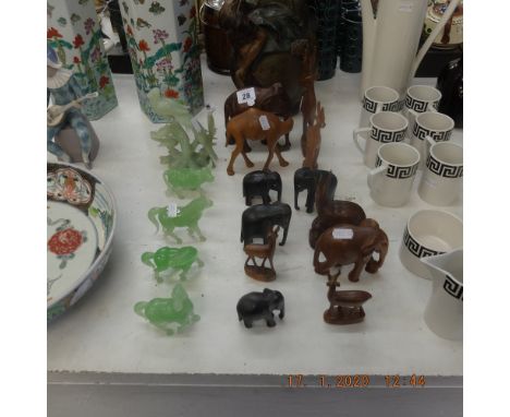 Am assortment of animal figures including a jade figure     