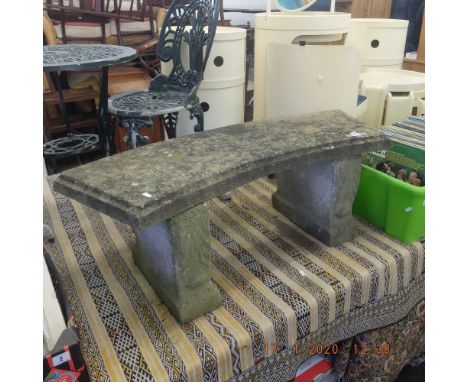 A stone garden bench