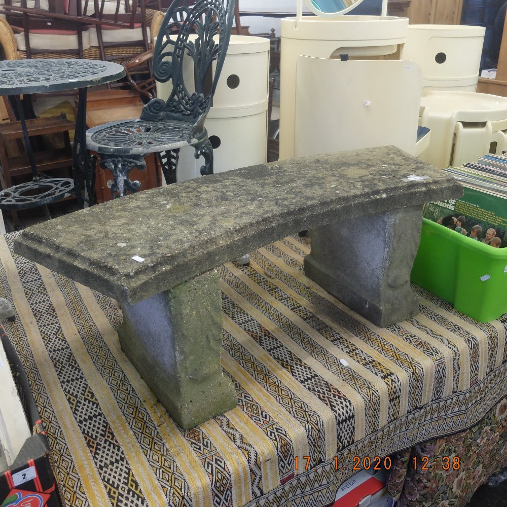 A stone garden bench