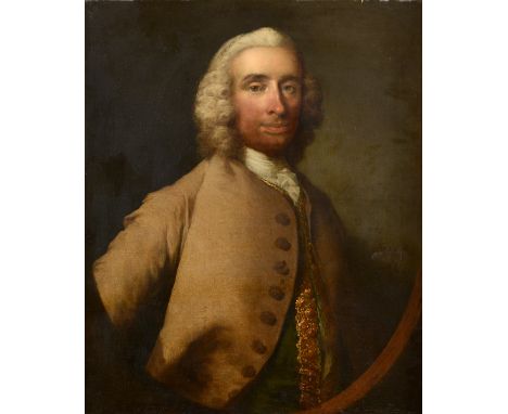 THOMAS FRYE (c.1710-1762) PORTRAIT OF A GENTLEMAN Quarter length, wearing a buff coat and brocaded waistcoat, within a painte