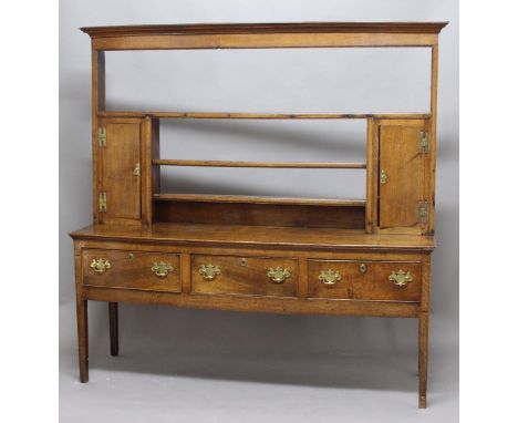 GEORGIAN OAK DRESSER, the three shelf plate rack with a pair of cupboards on a base with three cockbeaded drawers, height 194