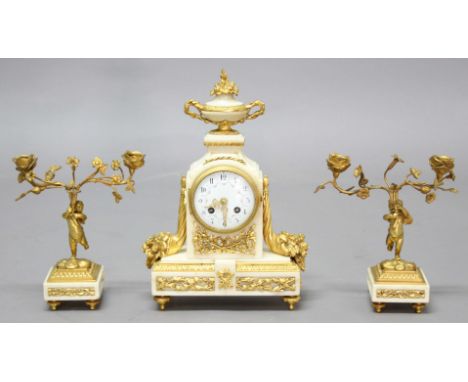 FRENCH ALABASTER AND GILT METAL MOUNTED CLOCK GARNITURE, late 19th century, the enamelled dial on brass eight day, half hourl