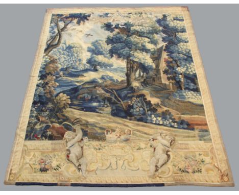 AUBUSSON TAPESTRY, possibly late 17th century, the central field of a cottage in a woodland setting with a jay and other bird