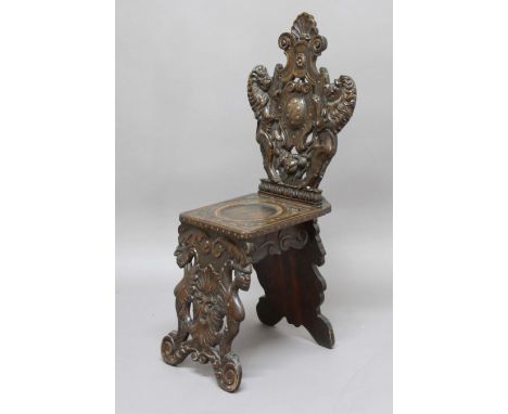 ITALIAN WALNUT SGABELLO CHAIR,  19th century, the back carved with a pair of rampant lions flanking a crest with six 'balls',