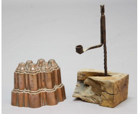 WROUGHT IRON RUSH LIGHT, fitted to a wooden base, height 28cm; together with copper jelly mould with six pinnacles, length 16