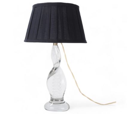 A French mid 20th century glass lamp, of spiral form with internal bubbles, polished pontil to base and new shade, overall he