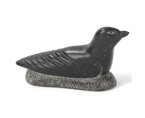 A Mid 20th Century Inuit green stone carving of a bird, signed AH and numbered 3295 -'79 with makers label "anada" to base, l