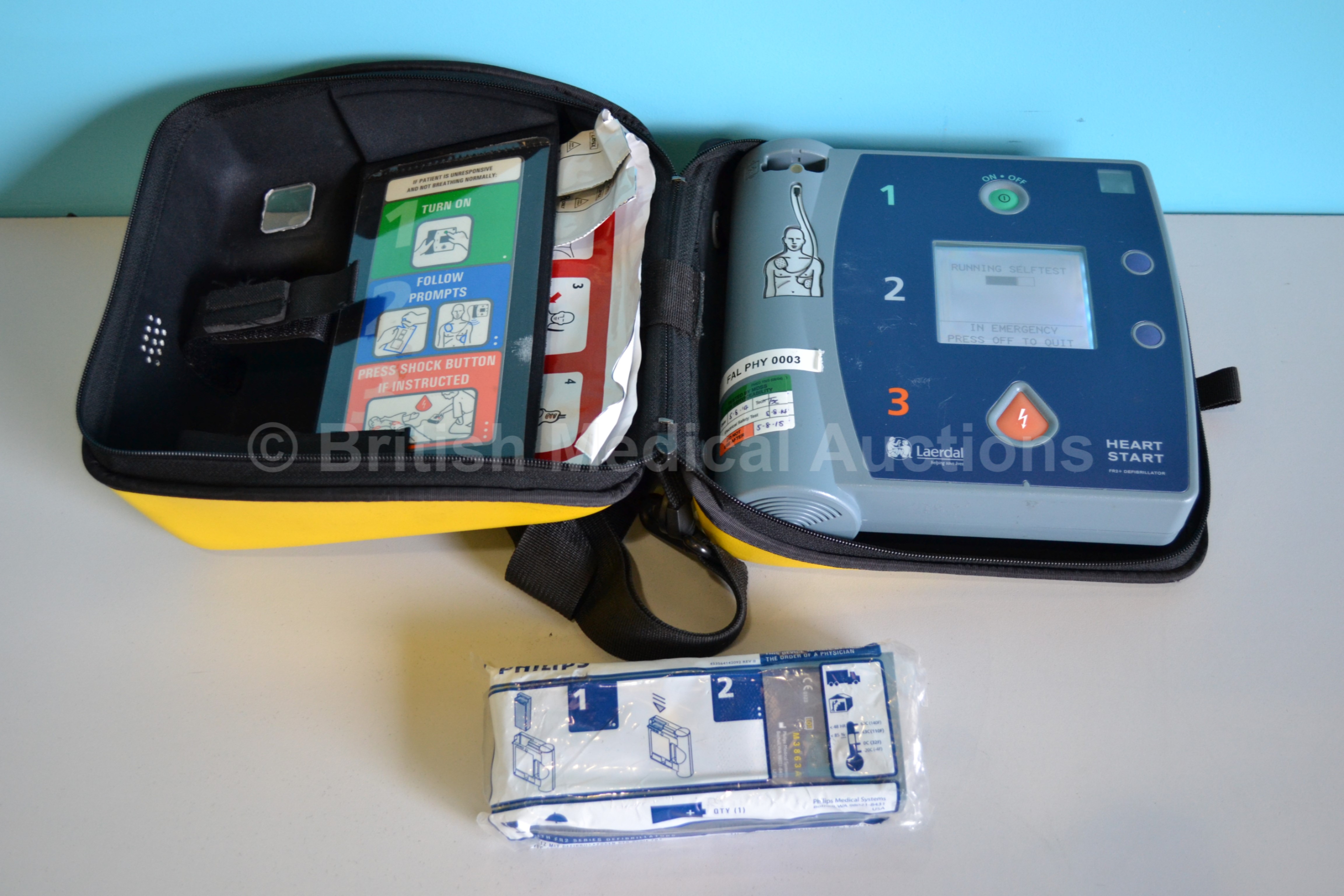 Laerdal Heartstart FR2+ Defibrillator with yellow case, spare battery