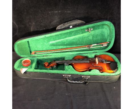 A 1/4 size violin, bow and carry case, labelled internally Antony Debut, A John Hornby Skewes product (3) 