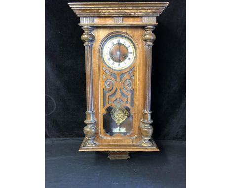 A Vienna Regulator wall clock, probably Gustav Becker, mahogany cased with fretwork glazed door, cream coloured dial with bla